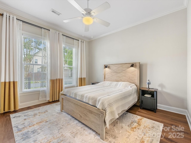 4148 Cedar Point Ave, Matthews, NC 28104 - bedroom with wood finished floors, multiple windows, crown molding, and a ceiling fan
