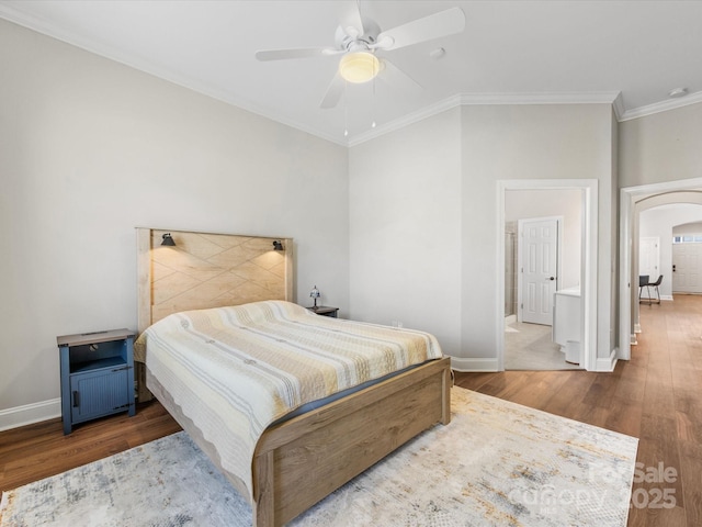4148 Cedar Point Ave, Matthews, NC 28104 - bedroom featuring wood finished floors, crown molding, arched walkways, vaulted ceiling, and ceiling fan