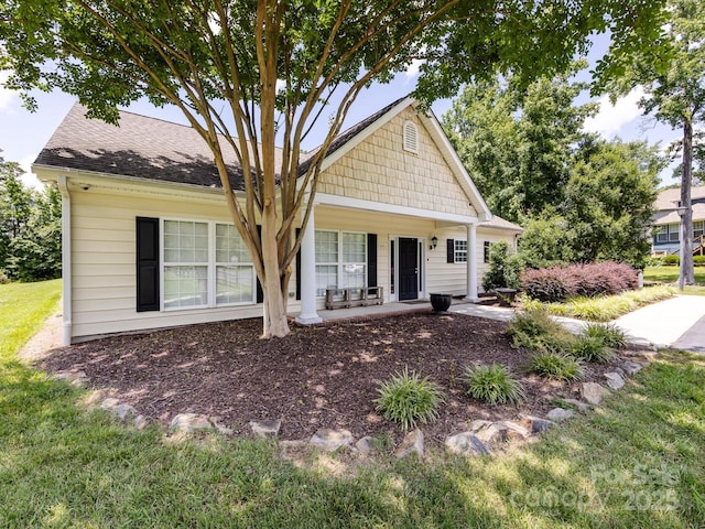 4148 Cedar Point Ave, Matthews, NC 28104 - view of front of home featuring a porch, a front yard, and roof with shingles