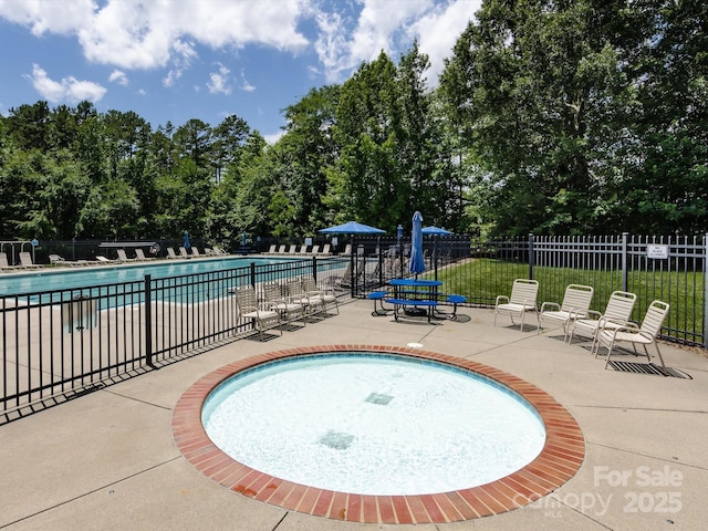4148 Cedar Point Ave, Matthews, NC 28104 - community pool featuring a patio and view of scattered trees