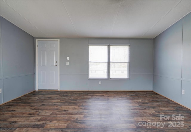 empty room featuring wood finished floors