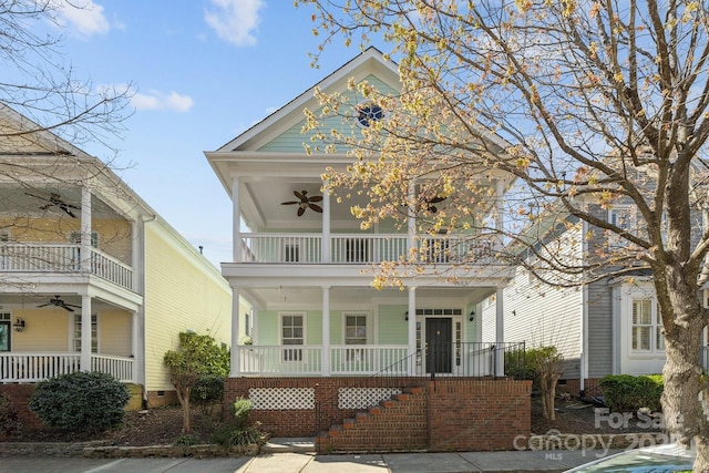 9652 Alma Blount Blvd, Charlotte, NC 28277 - greek revival house featuring a ceiling fan, stairway, a porch, and a balcony