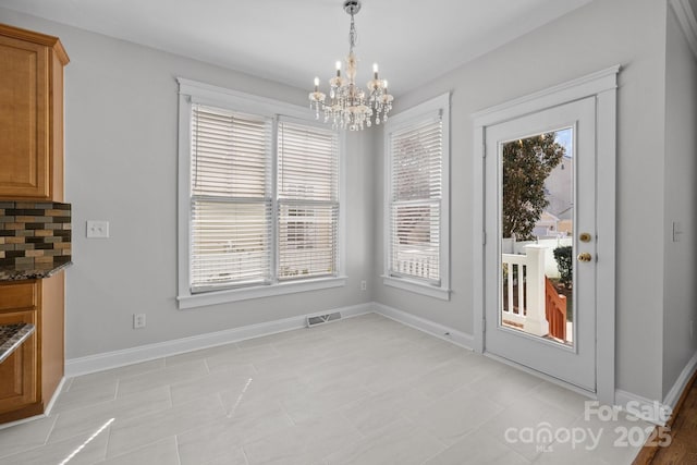 9652 Alma Blount Blvd, Charlotte, NC 28277 - unfurnished dining area with visible vents, baseboards, and a chandelier