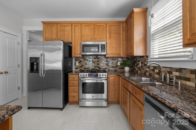 9652 Alma Blount Blvd, Charlotte, NC 28277 - kitchen featuring brown cabinets, stainless steel appliances, and a sink