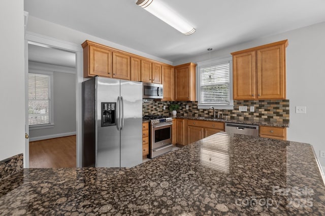 9652 Alma Blount Blvd, Charlotte, NC 28277 - kitchen with a sink, dark stone countertops, appliances with stainless steel finishes, and tasteful backsplash