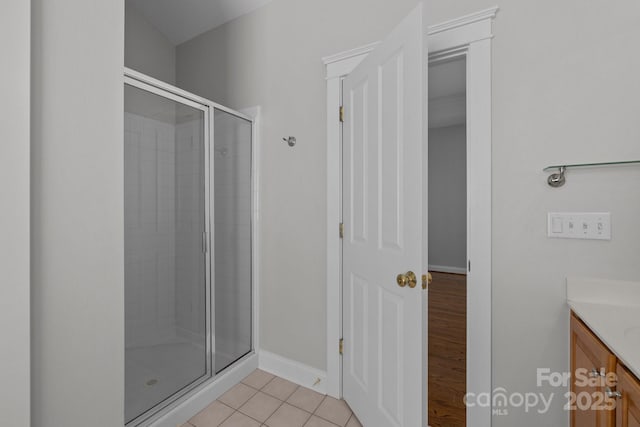 9652 Alma Blount Blvd, Charlotte, NC 28277 - full bathroom featuring baseboards, vanity, tile patterned flooring, and a stall shower