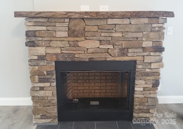 119 Tryon View Dr, Flat Rock, NC 28731 - detailed view of a fireplace, baseboards, and wood finished floors