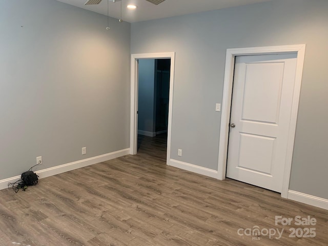 119 Tryon View Dr, Flat Rock, NC 28731 - unfurnished bedroom featuring wood finished floors and baseboards