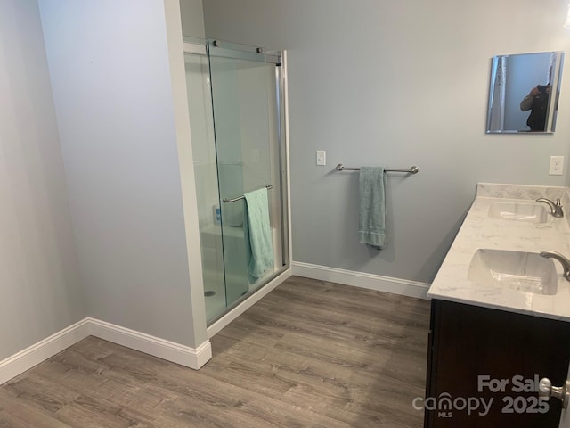 119 Tryon View Dr, Flat Rock, NC 28731 - bathroom featuring wood finished floors, a shower stall, and baseboards