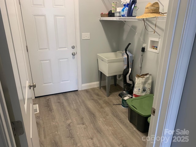 119 Tryon View Dr, Flat Rock, NC 28731 - washroom featuring washer hookup, wood finished floors, and baseboards