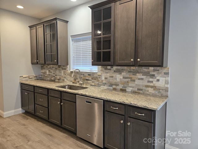 119 Tryon View Dr, Flat Rock, NC 28731 - kitchen with dishwasher, light wood-type flooring, decorative backsplash, dark brown cabinets, and recessed lighting