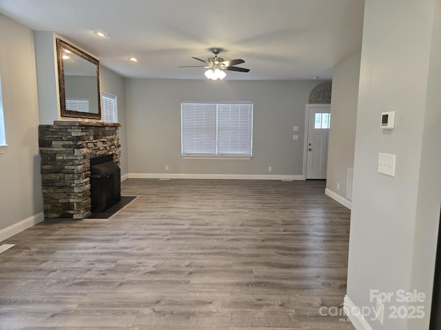 119 Tryon View Dr, Flat Rock, NC 28731 - unfurnished living room featuring a ceiling fan, wood finished floors, and recessed lighting
