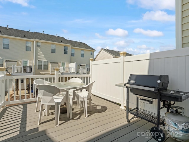 11846 Chelton Ridge Ln, Charlotte, NC 28277 - wooden deck with a grill, a residential view, and outdoor dining area