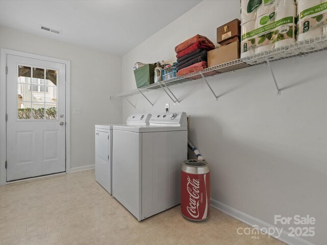 11846 Chelton Ridge Ln, Charlotte, NC 28277 - washroom with baseboards, visible vents, washer and dryer, and laundry area