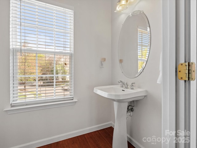 11846 Chelton Ridge Ln, Charlotte, NC 28277 - bathroom featuring a sink, baseboards, and wood finished floors