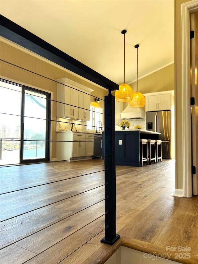 141 Sunrise Pt, New London, NC 28127 - kitchen featuring stainless steel fridge, custom exhaust hood, light wood-type flooring, black dishwasher, and backsplash