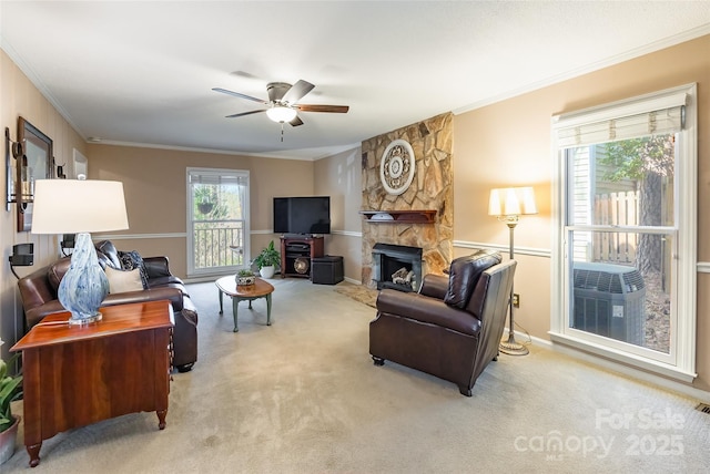 10028 Bora Bora Dr, Tega Cay, SC 29708 - living room featuring plenty of natural light, ceiling fan, carpet floors, and a fireplace