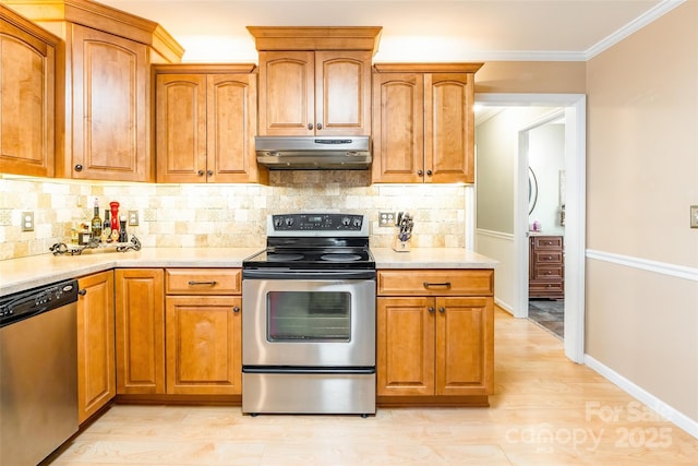 10028 Bora Bora Dr, Tega Cay, SC 29708 - kitchen with crown molding, brown cabinets, stainless steel appliances, tasteful backsplash, and under cabinet range hood