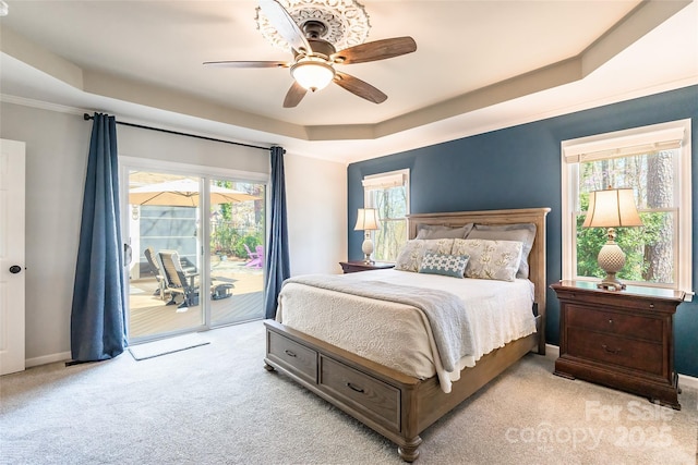 10028 Bora Bora Dr, Tega Cay, SC 29708 - bedroom with light colored carpet, baseboards, access to outside, a raised ceiling, and ceiling fan