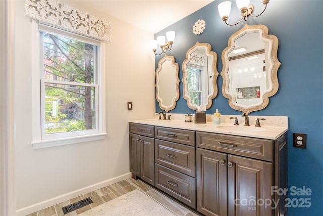 10028 Bora Bora Dr, Tega Cay, SC 29708 - bathroom featuring wood finish floors, a sink, baseboards, and visible vents
