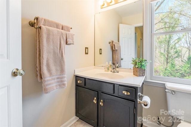 10028 Bora Bora Dr, Tega Cay, SC 29708 - bathroom with baseboards, toilet, and vanity