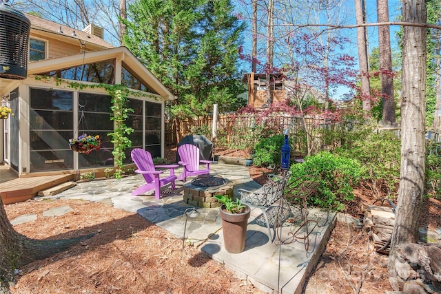 10028 Bora Bora Dr, Tega Cay, SC 29708 - view of patio with a sunroom, fence, a fire pit, and area for grilling
