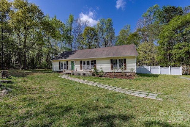 ranch-style house featuring crawl space, a front yard, and fence