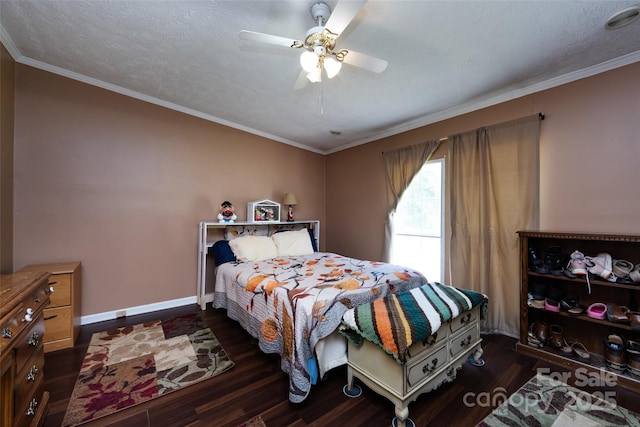 bedroom with dark wood-style floors, baseboards, and crown molding