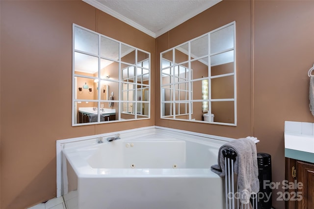 bathroom with a textured ceiling, ornamental molding, and a whirlpool tub