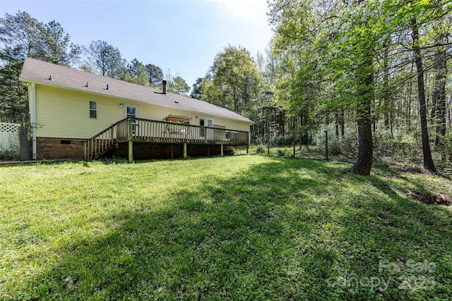 view of yard featuring a wooden deck