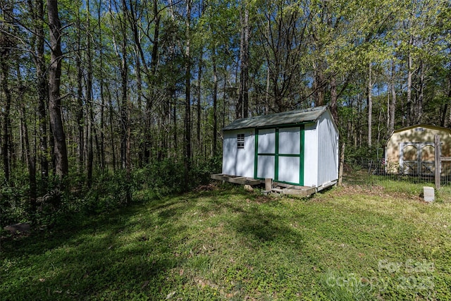 view of shed featuring a wooded view