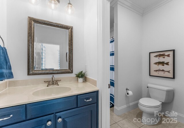 full bathroom featuring crown molding, tile patterned flooring, vanity, toilet, and baseboards