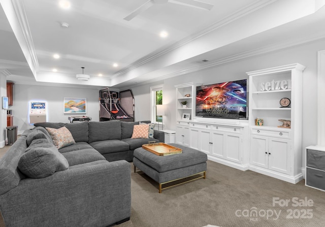 living area with crown molding, recessed lighting, ceiling fan, and dark colored carpet
