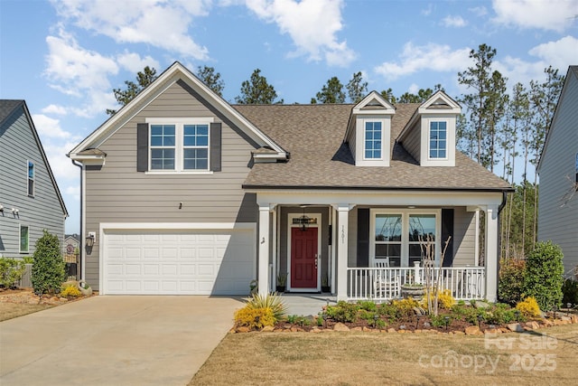 traditional-style home with covered porch, concrete driveway, roof with shingles, and an attached garage