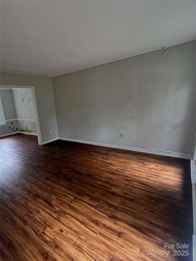 443 Silversmith Ln, Charlotte, NC 28270 - spare room with dark wood finished floors and baseboards
