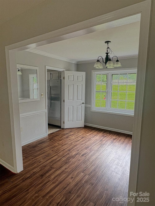 443 Silversmith Ln, Charlotte, NC 28270 - unfurnished dining area with crown molding, wood finished floors, baseboards, and a chandelier