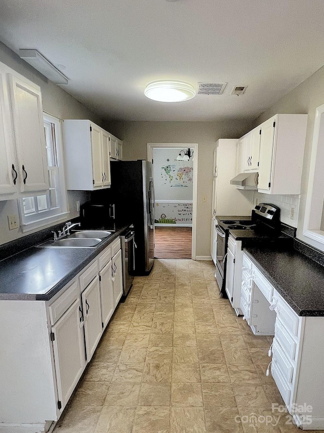 443 Silversmith Ln, Charlotte, NC 28270 - kitchen with appliances with stainless steel finishes, under cabinet range hood, a sink, and white cabinets
