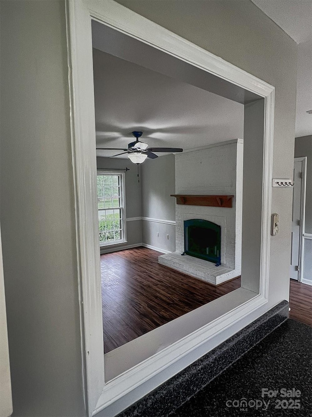 443 Silversmith Ln, Charlotte, NC 28270 - unfurnished living room with baseboards, a brick fireplace, and ceiling fan