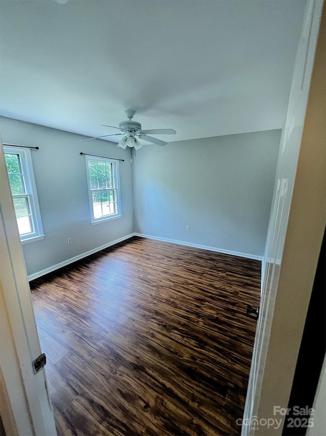 443 Silversmith Ln, Charlotte, NC 28270 - empty room with ceiling fan, dark wood-type flooring, and baseboards