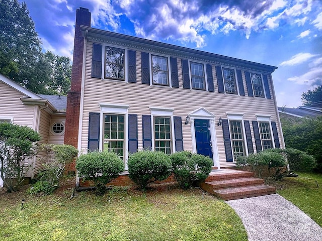 443 Silversmith Ln, Charlotte, NC 28270 - colonial house with a chimney and a front yard