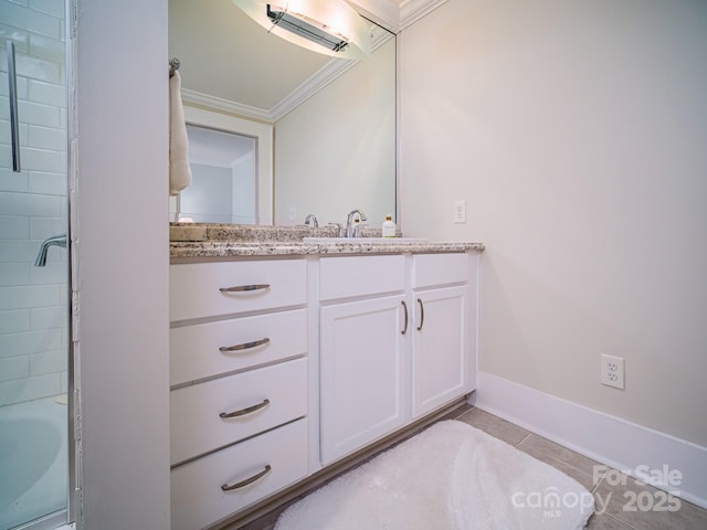 bathroom with a shower, vanity, crown molding, baseboards, and tile patterned floors