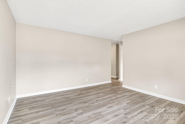 2801 Alleghany St, Charlotte, NC 28208 - spare room featuring light wood finished floors and baseboards