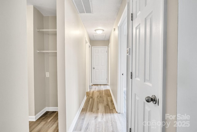 2801 Alleghany St, Charlotte, NC 28208 - hallway with baseboards, visible vents, and light wood-type flooring