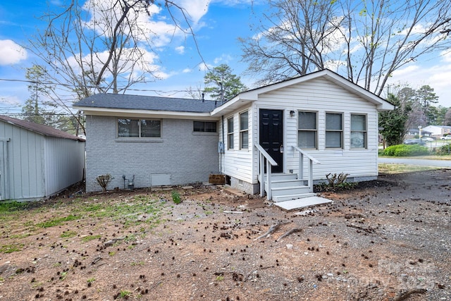 2801 Alleghany St, Charlotte, NC 28208 - view of front of property featuring crawl space, entry steps, brick siding, and roof with shingles