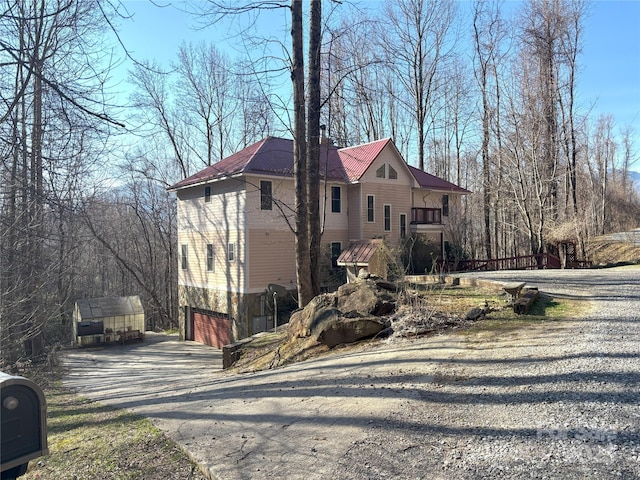 97 Hughes Dr, Maggie Valley, NC 28751 - view of property exterior featuring asphalt driveway and an attached garage