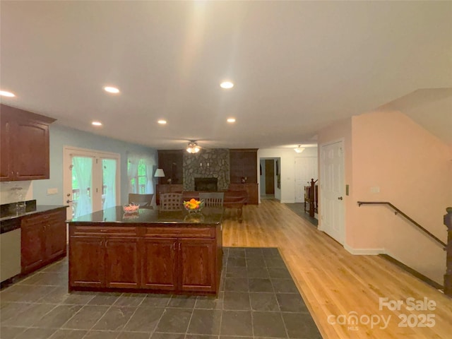97 Hughes Dr, Maggie Valley, NC 28751 - kitchen with a fireplace, recessed lighting, white dishwasher, open floor plan, and a center island
