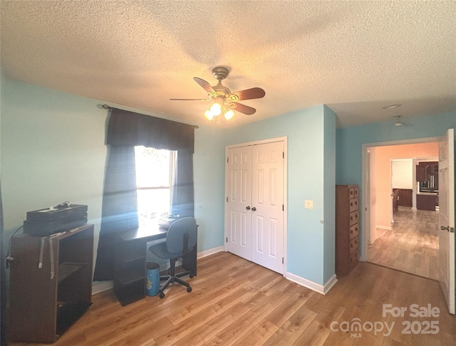 97 Hughes Dr, Maggie Valley, NC 28751 - office featuring a ceiling fan, wood finished floors, a textured ceiling, and baseboards