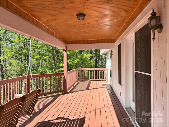 97 Hughes Dr, Maggie Valley, NC 28751 - wooden deck with view of wooded area