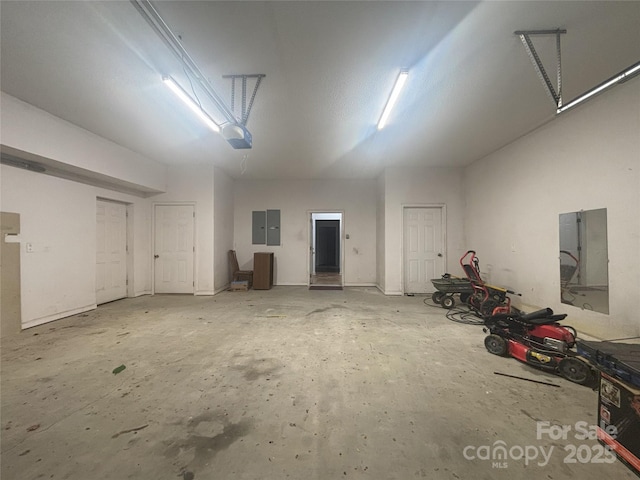 97 Hughes Dr, Maggie Valley, NC 28751 - garage featuring a garage door opener and electric panel