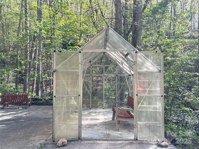 97 Hughes Dr, Maggie Valley, NC 28751 - view of greenhouse featuring a forest view